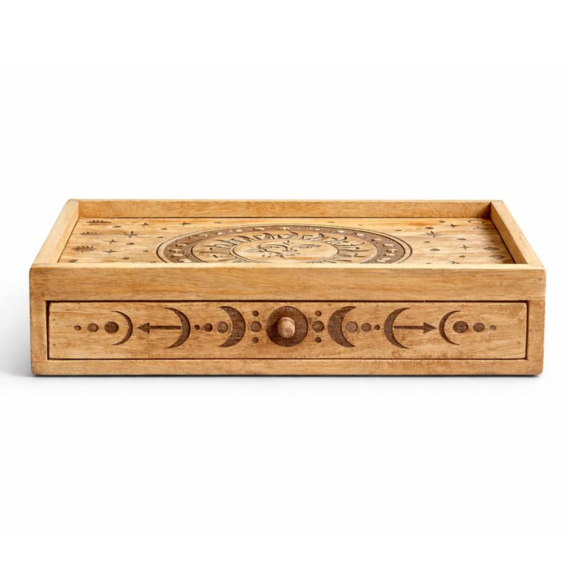 Carved sun and moon detail on the tarot box