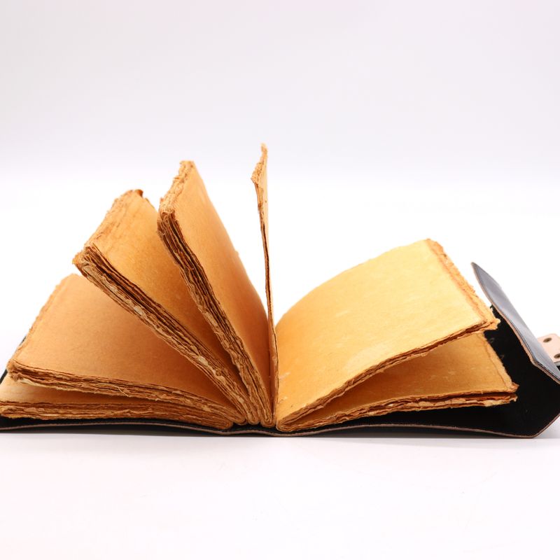 Deckle-edged pages inside the journal